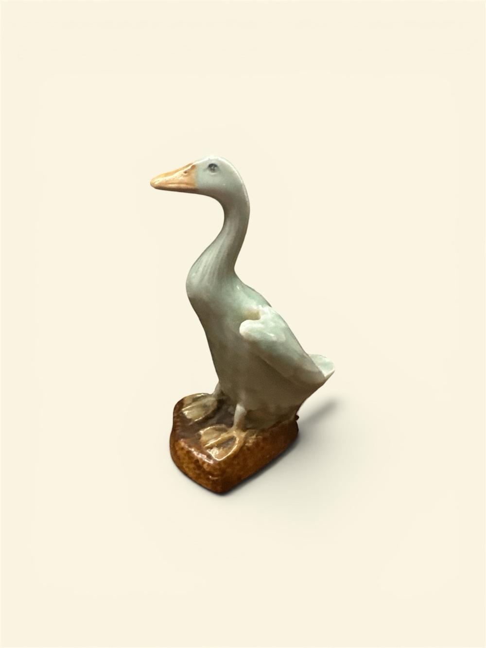 A vintage Chinese celadon porcelain duck figurine.